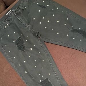 Studded distressed black jeans.